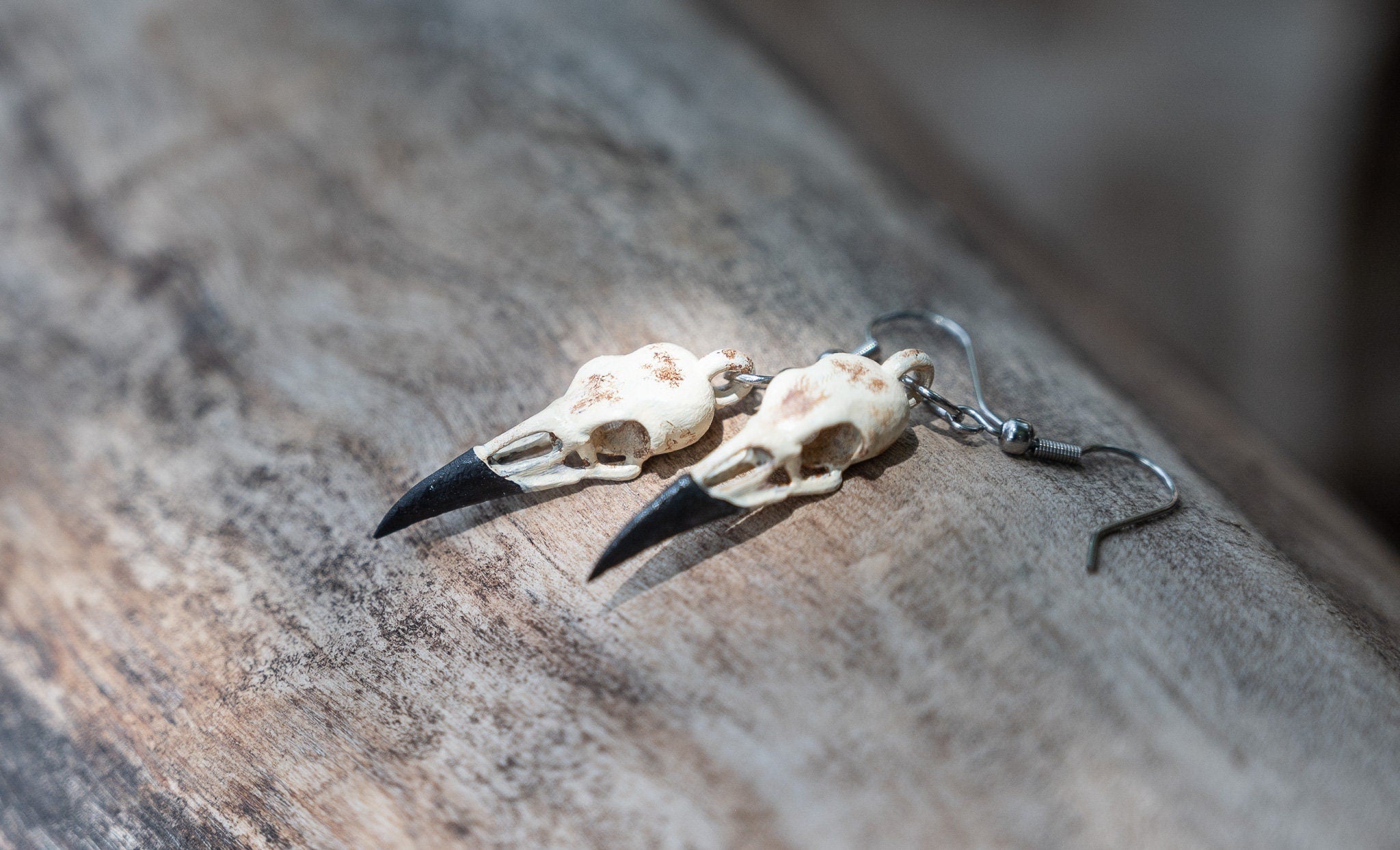 Shops crow skull earrings